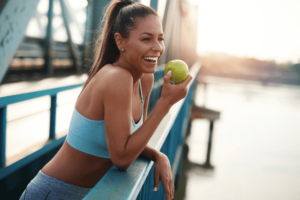 Image of woman living a healthy lifestyle including high-fiber diet, and exercise to prevent hemorrhoids.