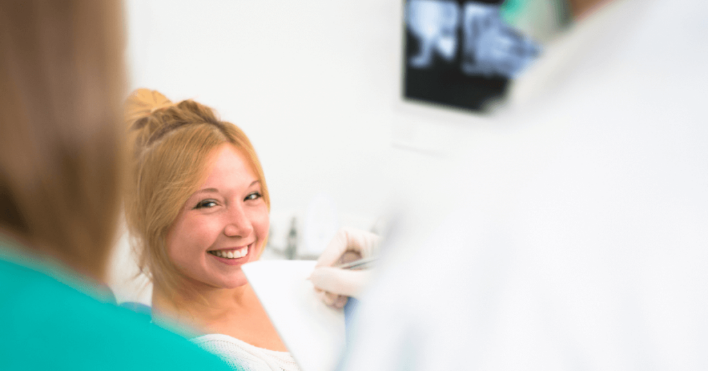 A woman radiating happiness and fulfillment after undergoing a minimally invasive procedure.