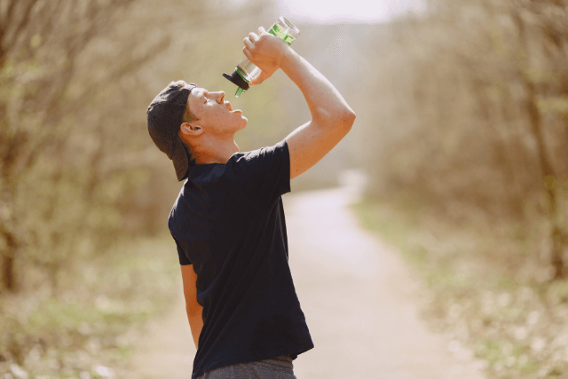 Drinking water to prevent hemorrhoids and support bowel health.